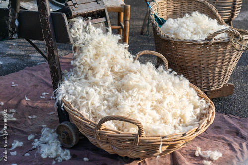 Sheep wool in wicker baskets , shaven wool. photo