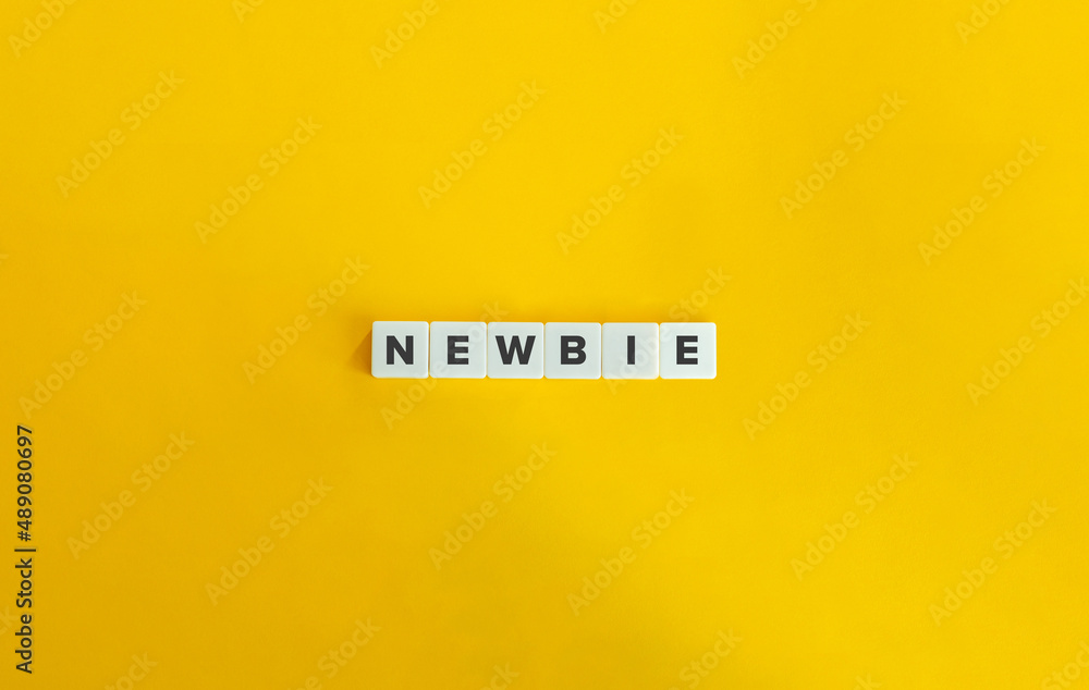 Newbie Word on Letter Tiles on Yellow Background. Minimal Aesthetics. Newbie Word on Letter Tiles on Yellow Background. Minimal Aesthetics.