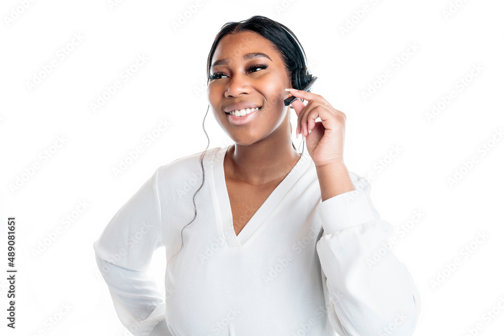 Studio portrait of a beautiful business woman dark-skinned holding with headset Studio portrait of a beautiful business woman dark-skinned holding with headset