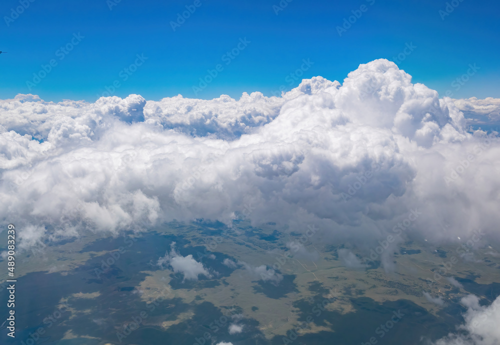 Aerial view of mountain landscape, view from window seat in an airplane