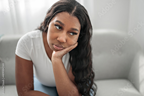 Schilderij op canvas Stressed miserable black woman suffer from grief problem, depressed lonely upset