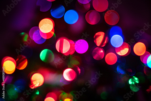 blurred Christmas lights on tree with vibrant colors background