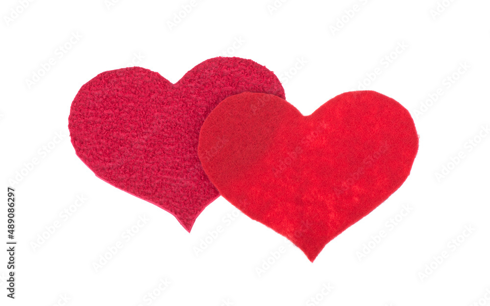 two hearts cut out of felt isolated on white background