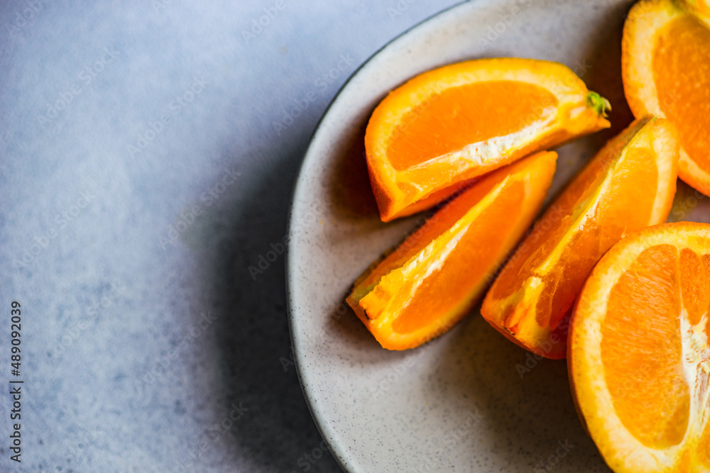 Slices of ripe orange fruits