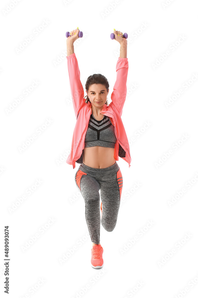 Young sporty woman training with dumbbells on white background Young sporty woman training with dumbbells on white background