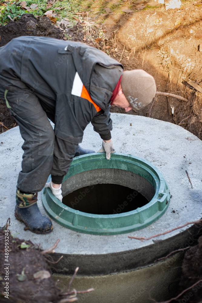 Loader Lowers Concrete Ring Dug Hole Build Septic Tank Worker Stock Photo  by ©levnat 458951334