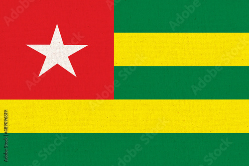 Flag of Togo. Tongolese flag on fabric surface. Fabric texture