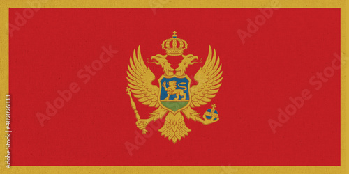 Flag of Montenegro. Montenegro flag on fabric surface. Fabric texture