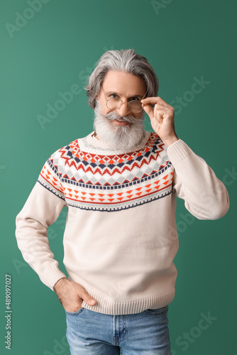 Handsome senior man in knit...