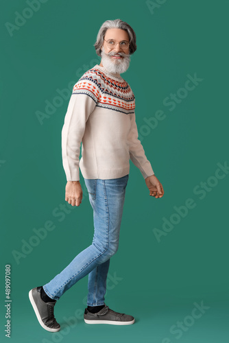 Handsome senior man in knit...