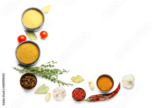 Bowls of different spices and herbs on white background