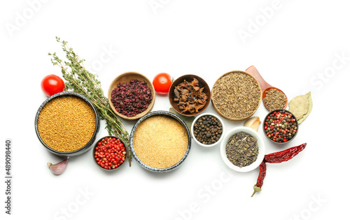 Fototapeta Naklejka Na Ścianę i Meble -  Set of different spices and herbs on white background