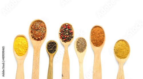 Fototapeta Naklejka Na Ścianę i Meble -  Wooden spoons with different spices isolated on white background, closeup