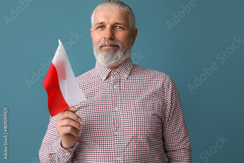 Mature man with flag of Pol...