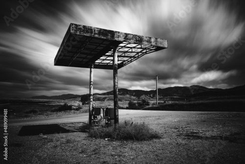 An old and abandoned gas station in front of the town of Korca in Albania near the border with Macedonia