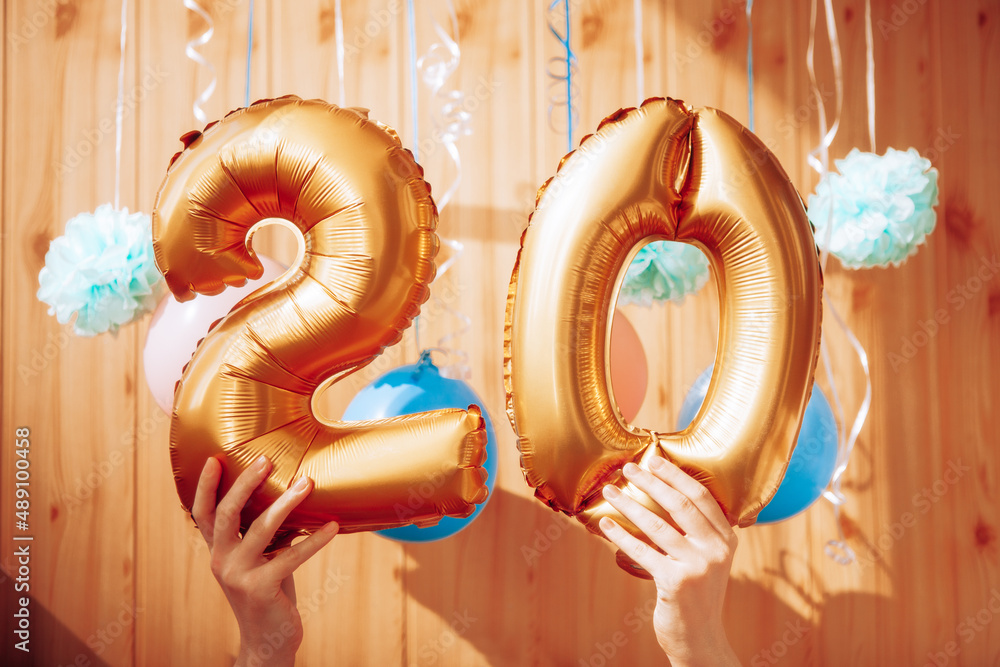 Φωτογραφία Happy twentieth birthday with golden number twenty 20 balloons and colorful deco