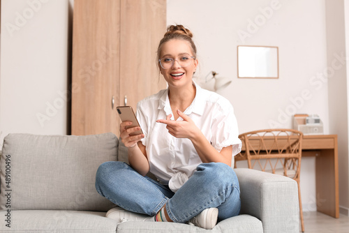 Pretty young woman using mo...
