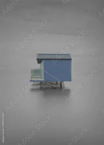 Fototapeta A moody long exposure of beach hut in Essex