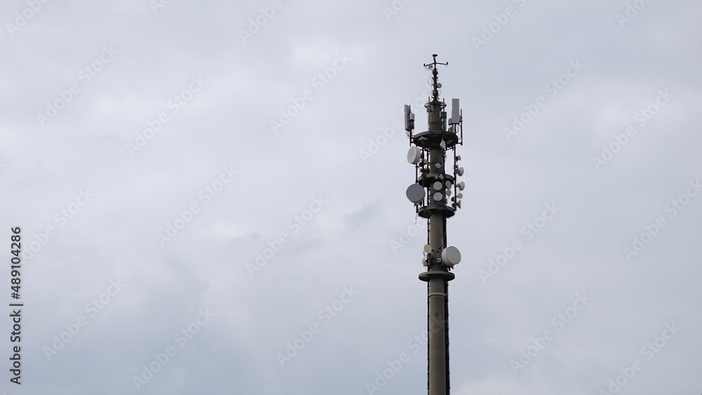 telecommunication tower, telephone antenna against sky