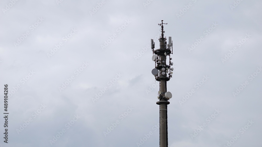 telecommunication tower, telephone antenna against sky telecommunication tower, telephone antenna against sky