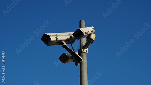 urban video surveillance cameras against sky