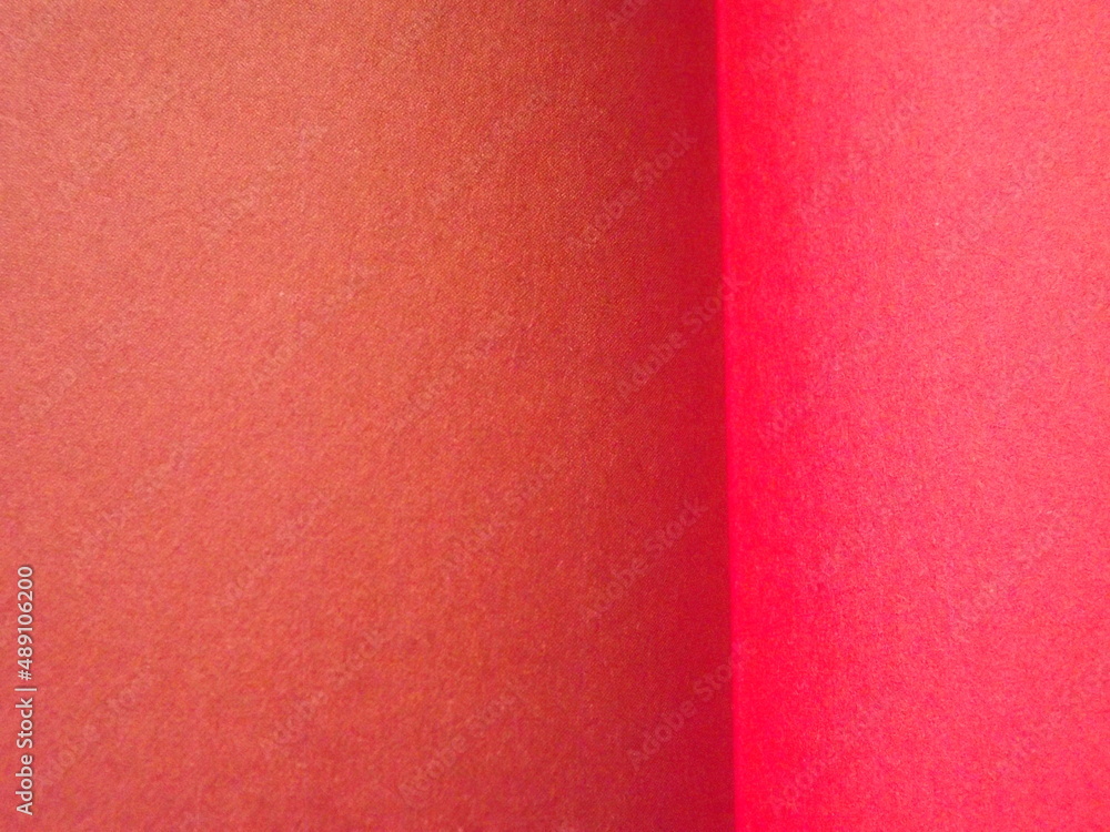 Fototapeta premium Burgundy, crimson, red, pink paper surface with a clear separation of colors as a background. High quality photo