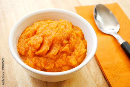 A White Bowl Filled with Mashed Carrots or Butternut Squash photo