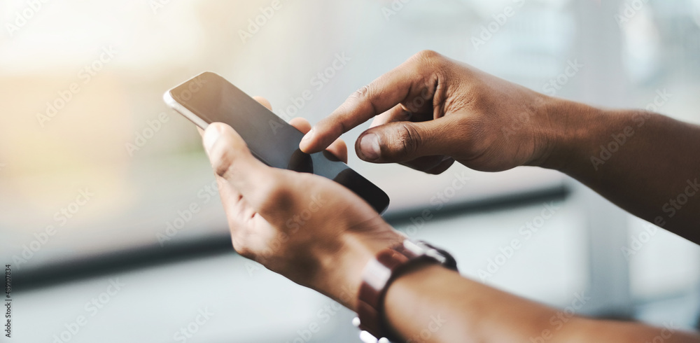 Obraz premium Reach out and make that connection. Closeup shot of a businessman using a cellphone.