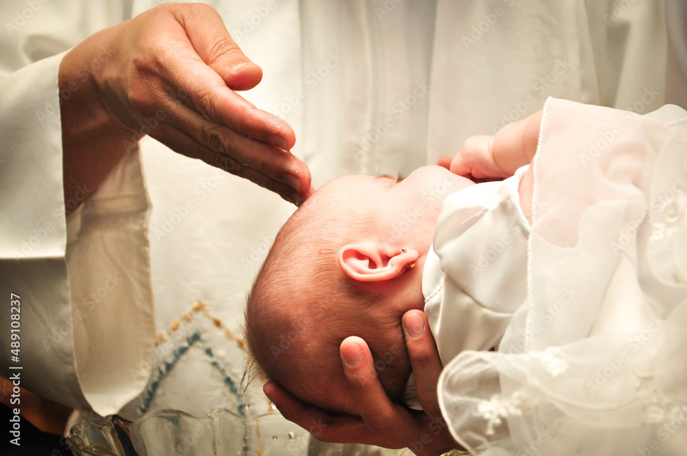 Baby girl getting baptized - obrazy, fototapety, plakaty 