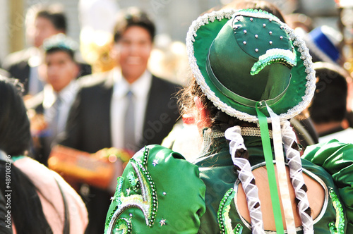 Girl with traditional costume and a green hat