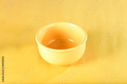 yellow porcelain bowl , empty isolated on yellow background