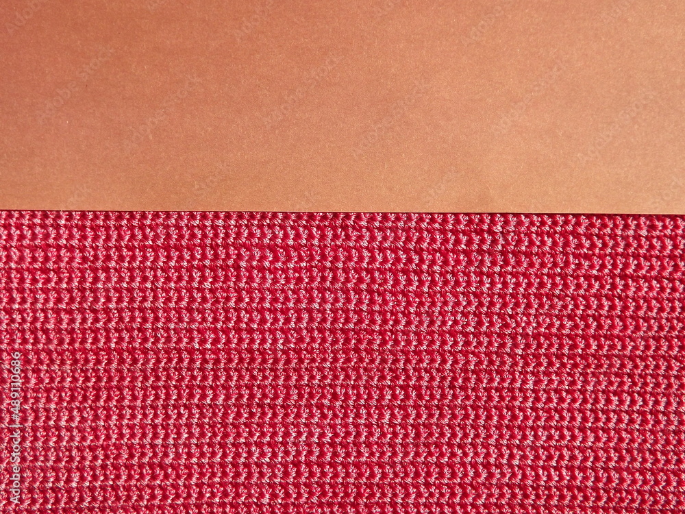 Knitted fabric of pink, crimson color close-up as a background. High quality photo Knitted fabric of pink, crimson color close-up as a background. High quality photo