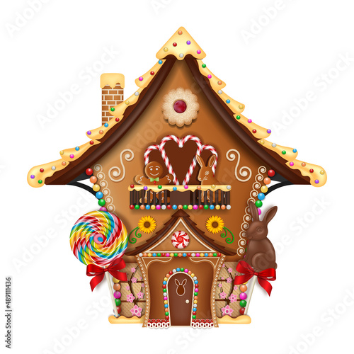 isolated easter gingerbread house with cookies and candies