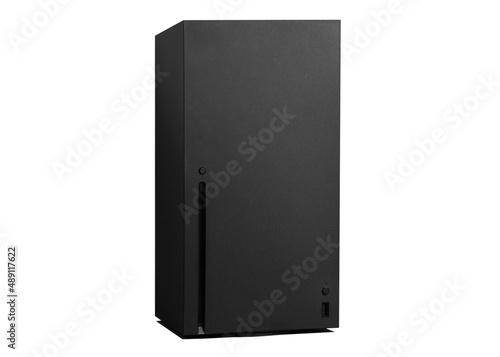 Black video game console on white background with shadows.
