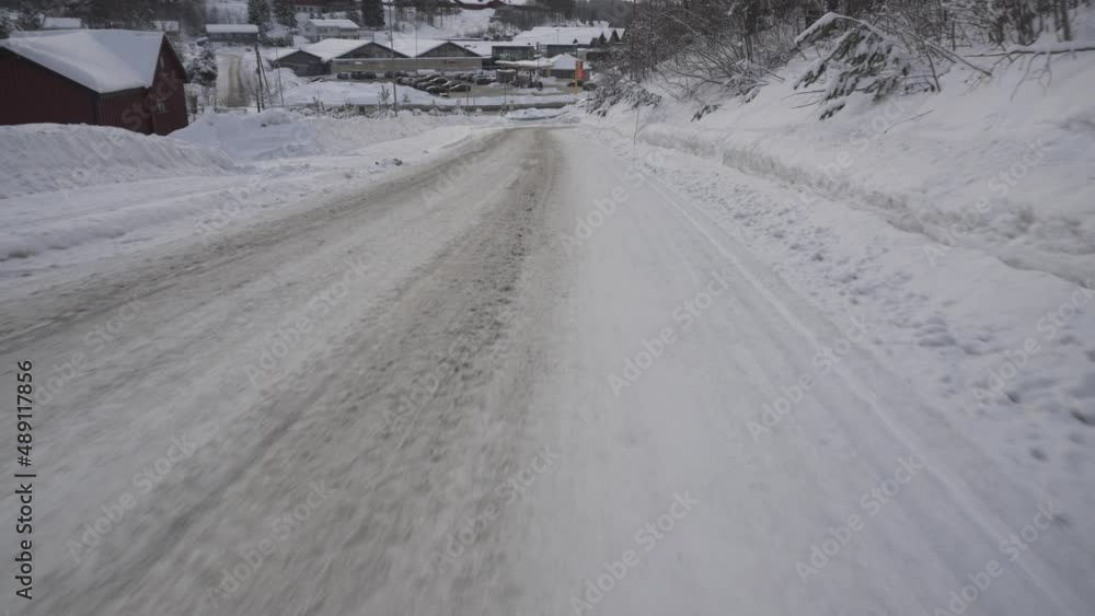 Snow Covered Dirt Road In The Countryside - aerial low Snow Covered Dirt Road In The Countryside - aerial low