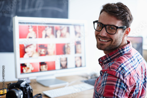 Find your place in the working world. Portrait shot of a creative professional at his desk working at his computer.