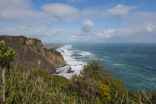 A small rocky outcrop at Mercer Bay, West Coast Beach near Auckland, New Zealand.