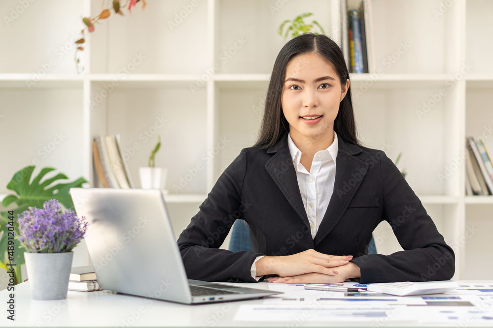 Asian businesswoman working on laptop analyzing financial graphs financial statistics profit growth business idea Asian businesswoman working on laptop analyzing financial graphs financial statistics profit growth business idea