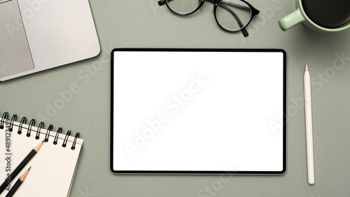 Modern office desk workspace with tablet white screen mockup.