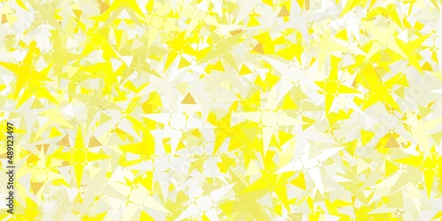 Light Yellow vector background with polygonal forms.