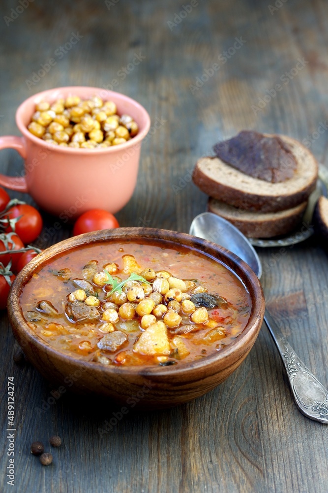 CHICKPEA AND BEEF STEW, soup with chickpeas and meat, hearty chowder, latin cuisine CHICKPEA AND BEEF STEW, soup with chickpeas and meat, hearty chowder, latin cuisine