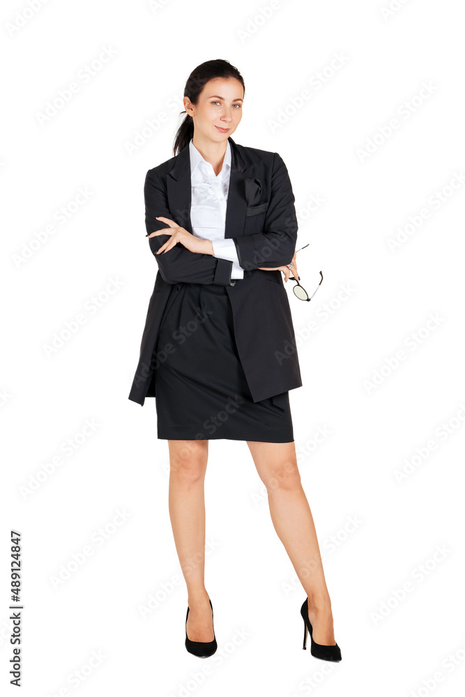 Business women in black suits hold glasses in a hip position while looking ahead. Portrait on white background with studio light. Business women in black suits hold glasses in a hip position while looking ahead. Portrait on white background with studio light.