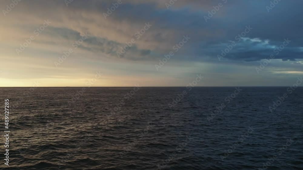 Beautiful shot of sunset flying towards the ocean. Beautiful shot of sunset flying towards the ocean.