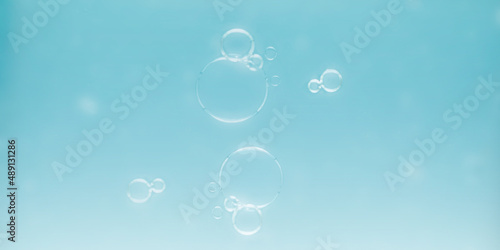 Soap bubbles with light blue background for text and advertising.