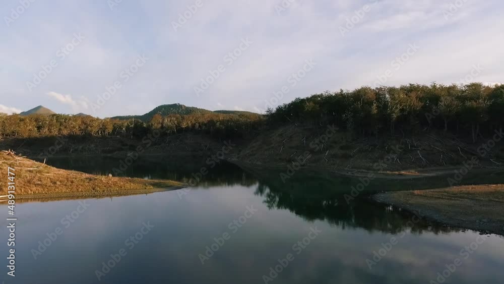 Aerial view of the lake and forest at sunset in Reserva Corazón de la Isla in Tierra del Fuego, Patagonia Argentina. Aerial view of the lake and forest at sunset in Reserva Corazón de la Isla in Tierra del Fuego, Patagonia Argentina.