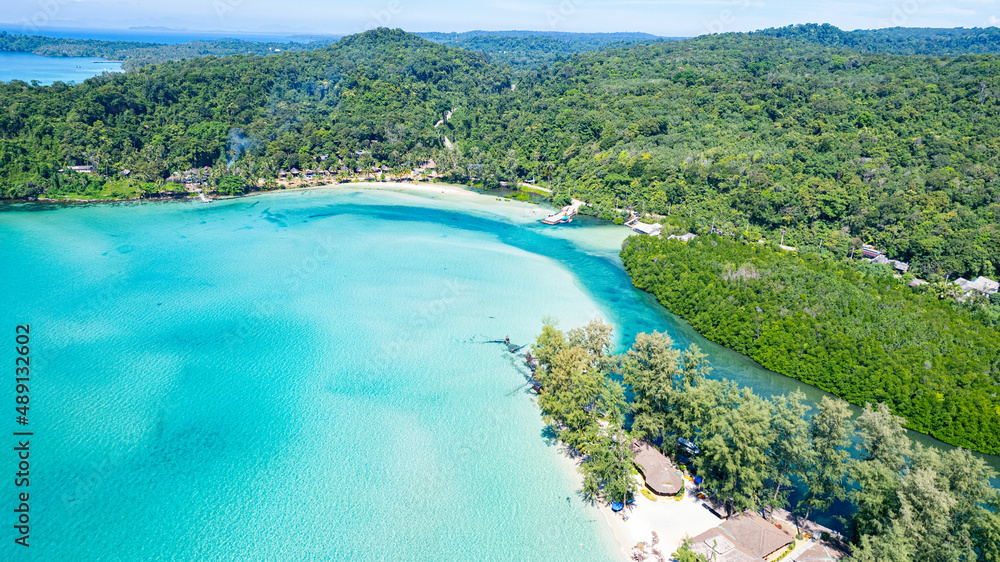 High aerial view of azure waters, white sandy beaches and rich forest nature
