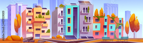 Green city with eco houses autumn landscape, modern architecture with solar panels, plants growing on house roof or balconies, park at front yard with paves, trees, benches Cartoon vector illustration