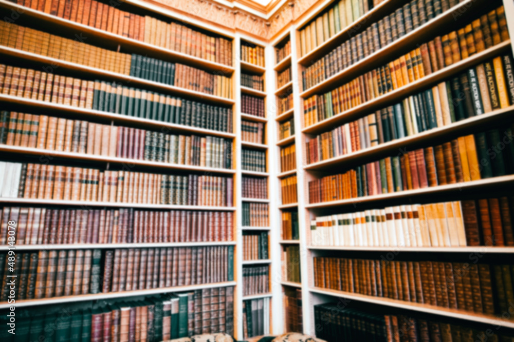 Blurred background of bookshelf full of books
