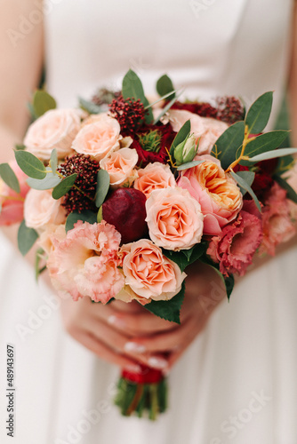 .Wedding bouquet in hands.