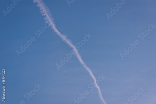 Trace of a flying plane in the sky.